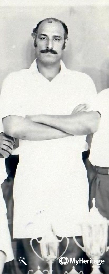 Dada Abu standing among teammates in white sports kit