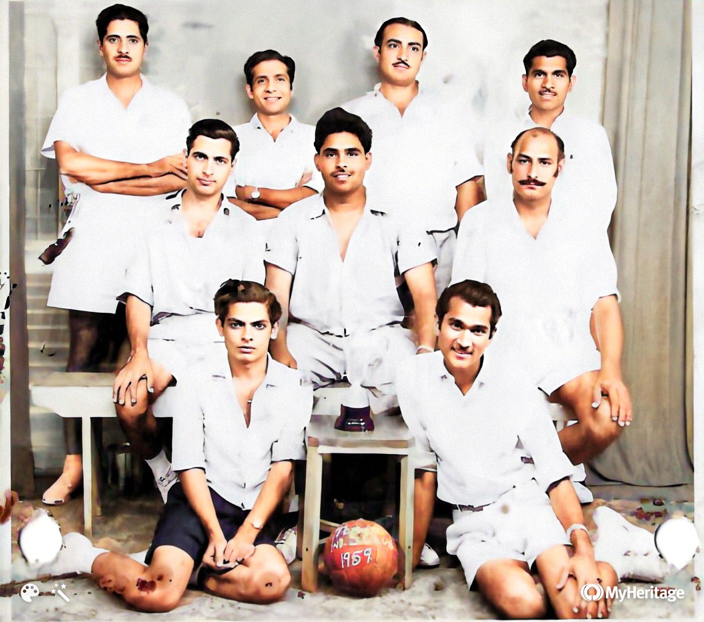 Sports team group photograph with a ball marked 1959